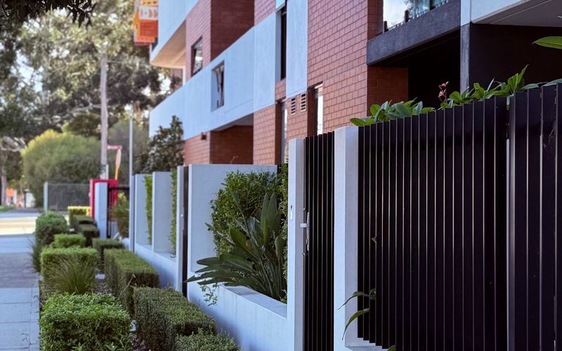 Modern block of flats with landscaped communal access